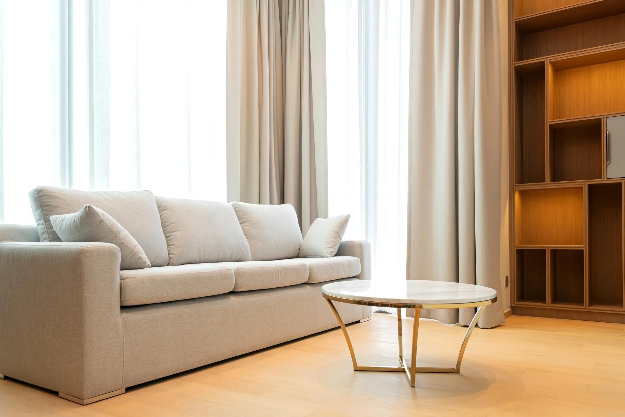 Window blinds and roman shades in a bright room